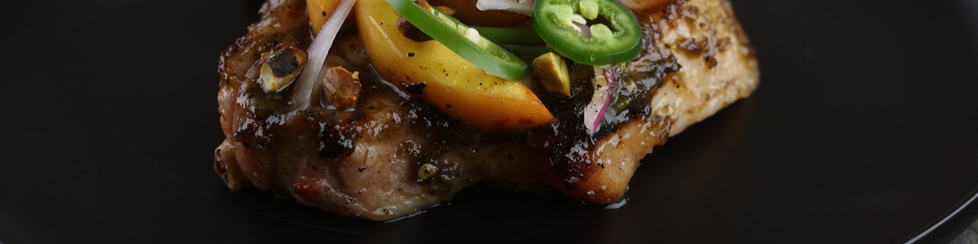 Smoked Jalapeño Glazed Pork Chop with Grilled Peaches